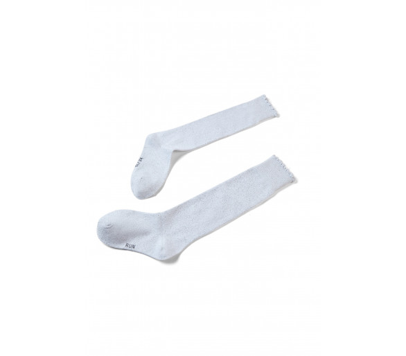 SOMEONE: Golden lurex socks with small frills.
