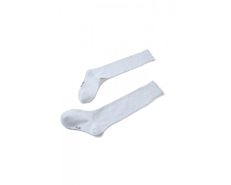 SOMEONE: Golden lurex socks with small frills.