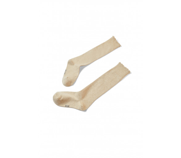 SOMEONE: Golden lurex socks with small frills.