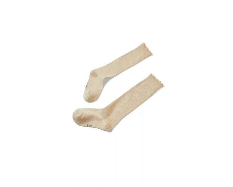 SOMEONE: Golden lurex socks with small frills.