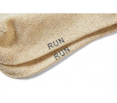 SOMEONE: Golden lurex socks with small frills.