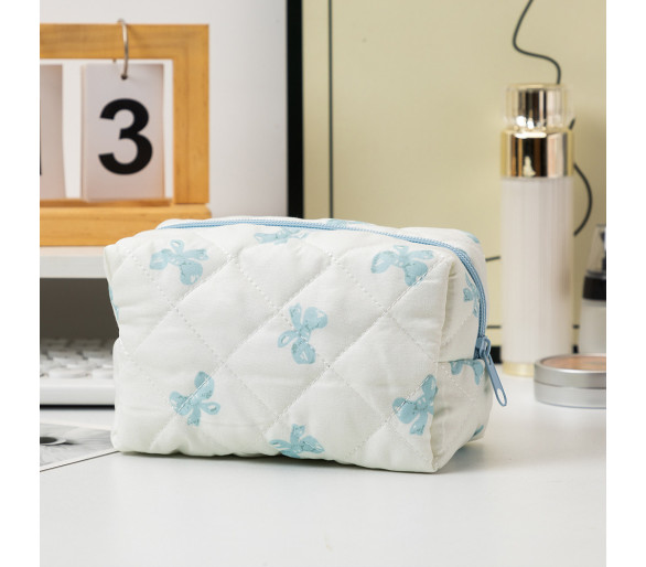 Trousse de maquillage à nœud bleu